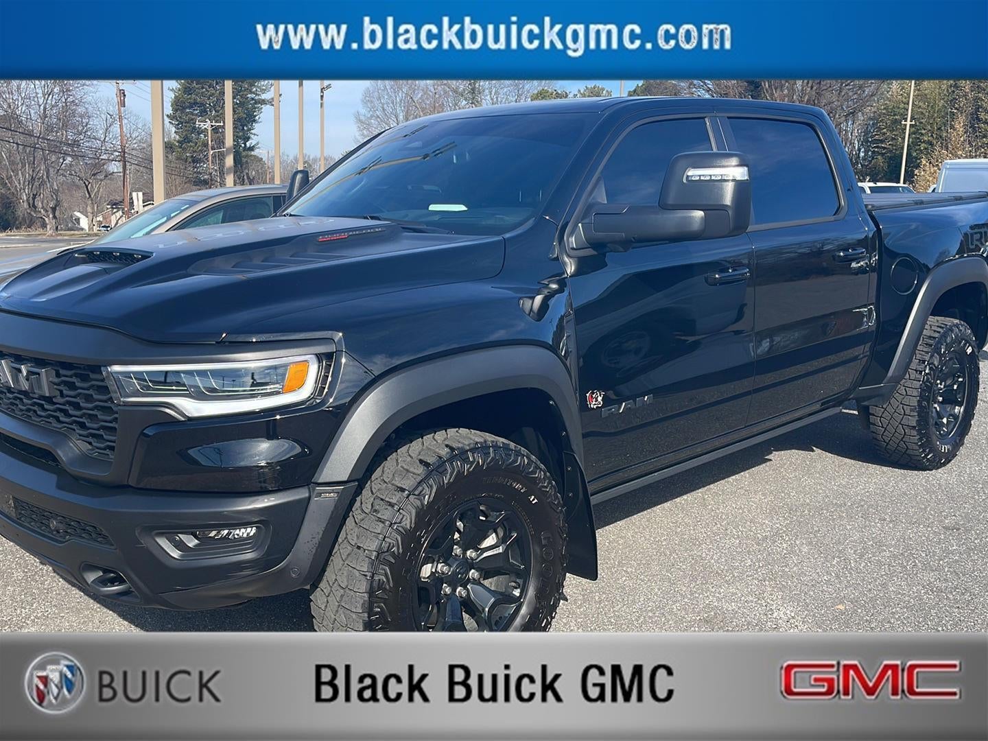 2025 RAM 1500 RHO in Diamond Black Cry — front three-quarter view