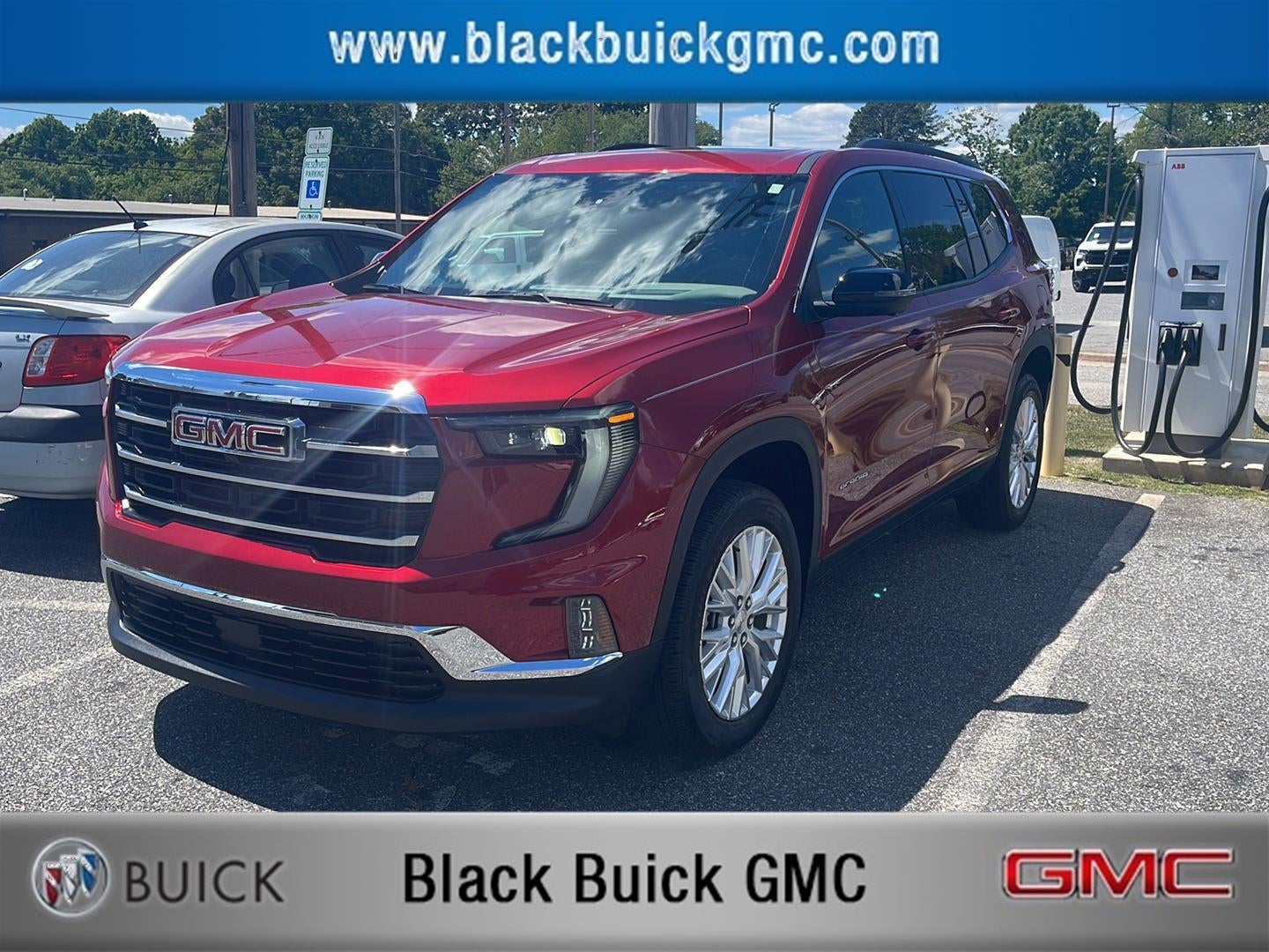 2025 GMC Acadia Elevation in Volcanic Red Tintcoat — front three-quarter view