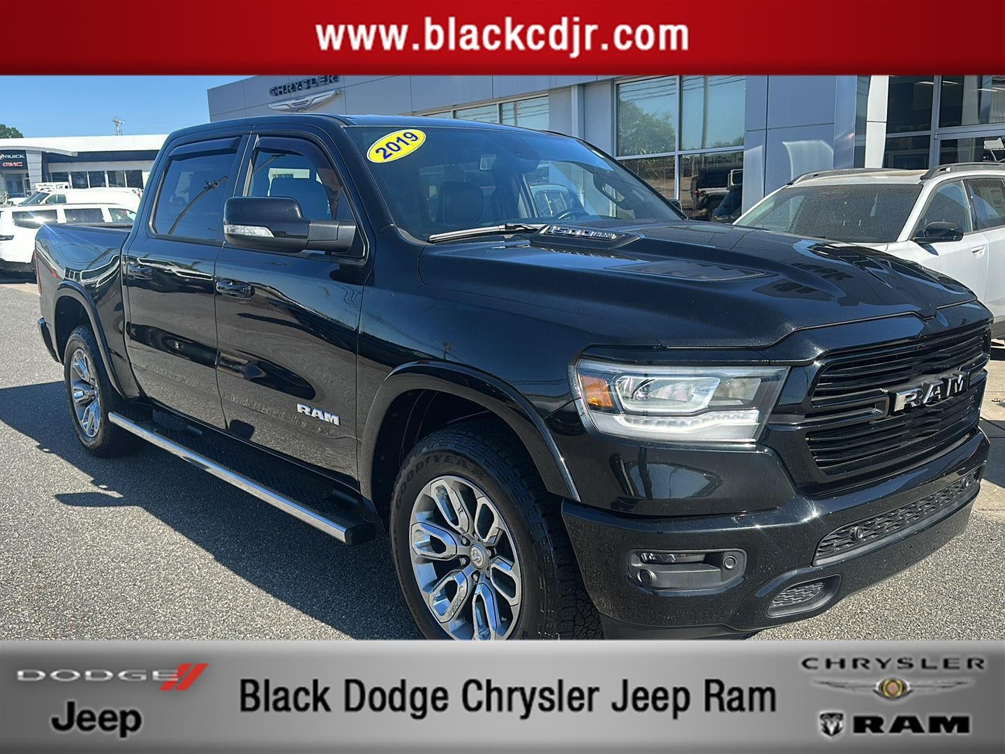 2019 RAM 1500 Laramie Crew Cab 4x4 5'7' Box in Diamond Black Crystal Pearlcoat — front three-quarter view