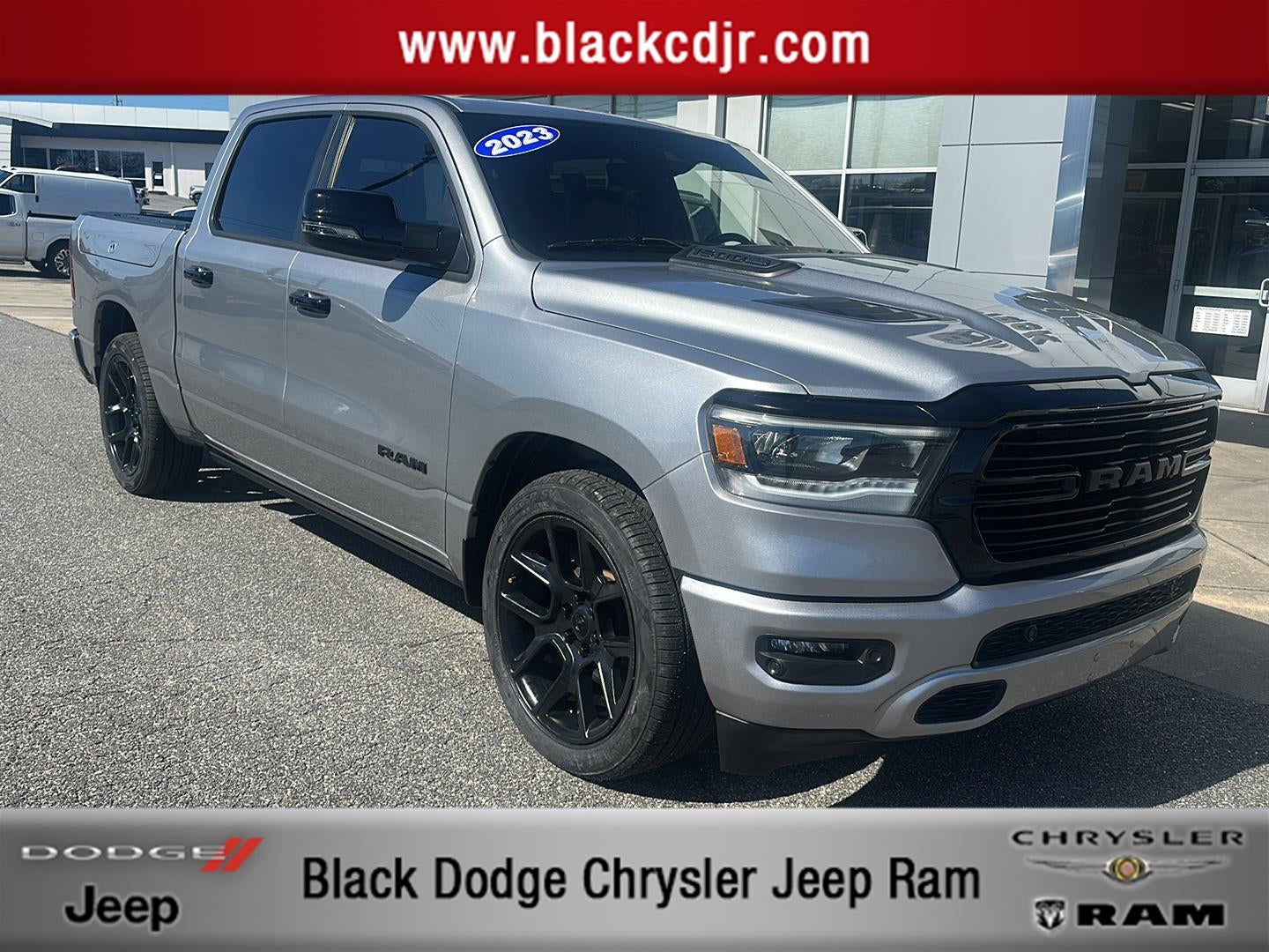 2023 RAM 1500 Laramie Crew Cab 4x4 5'7' Box in Billet Silver Metallic Clearcoat — front three-quarter view
