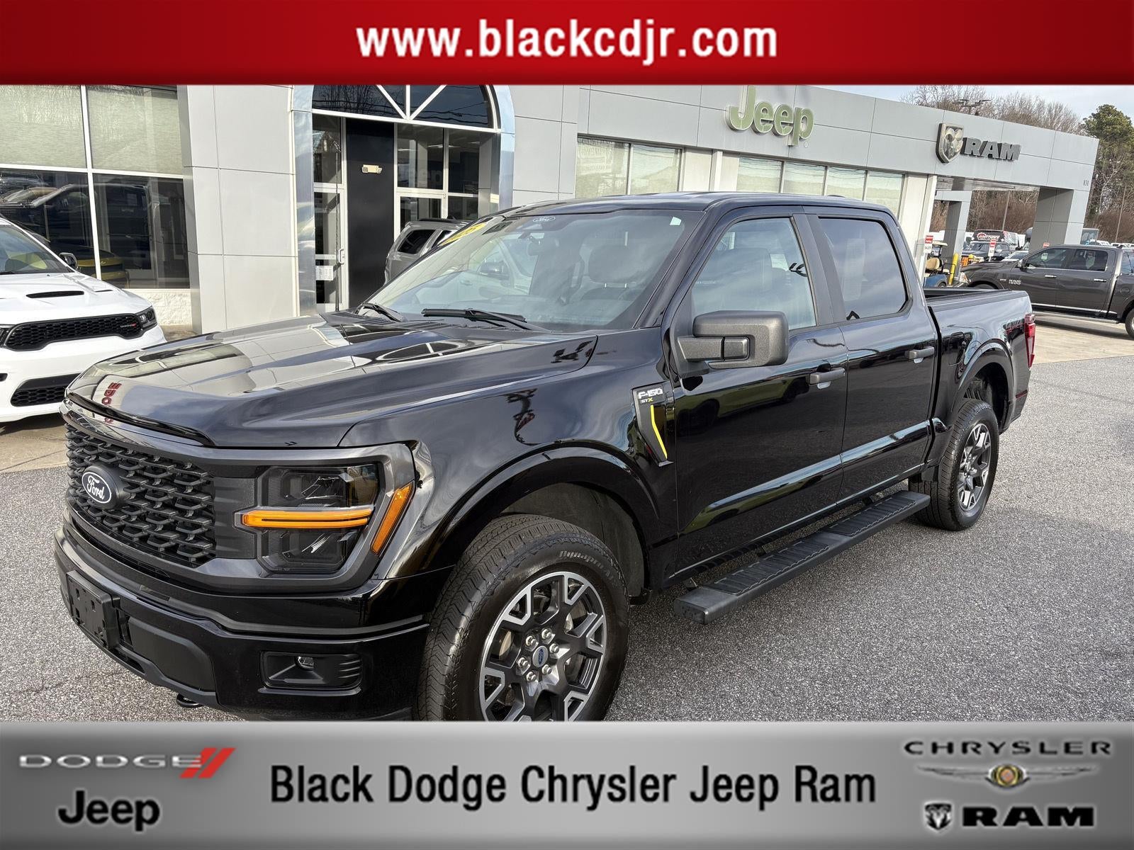 2025 Ford F-150 STX in Agate Black Metallic — front three-quarter view