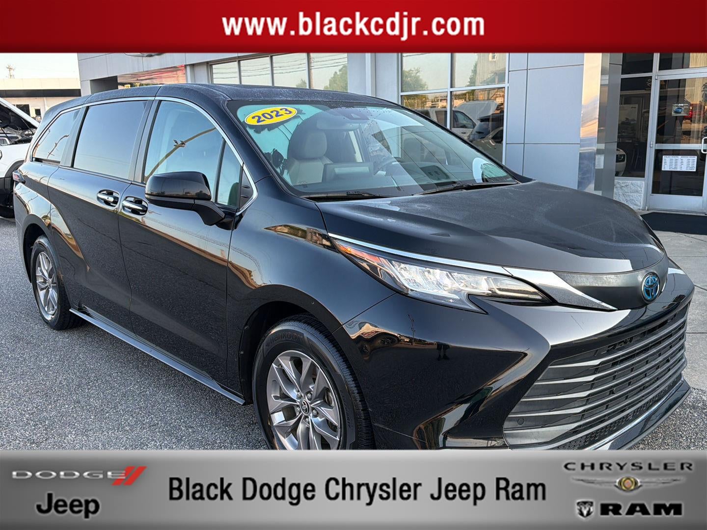 2023 Toyota Sienna XLE in Midnight Black Metallic — front three-quarter view