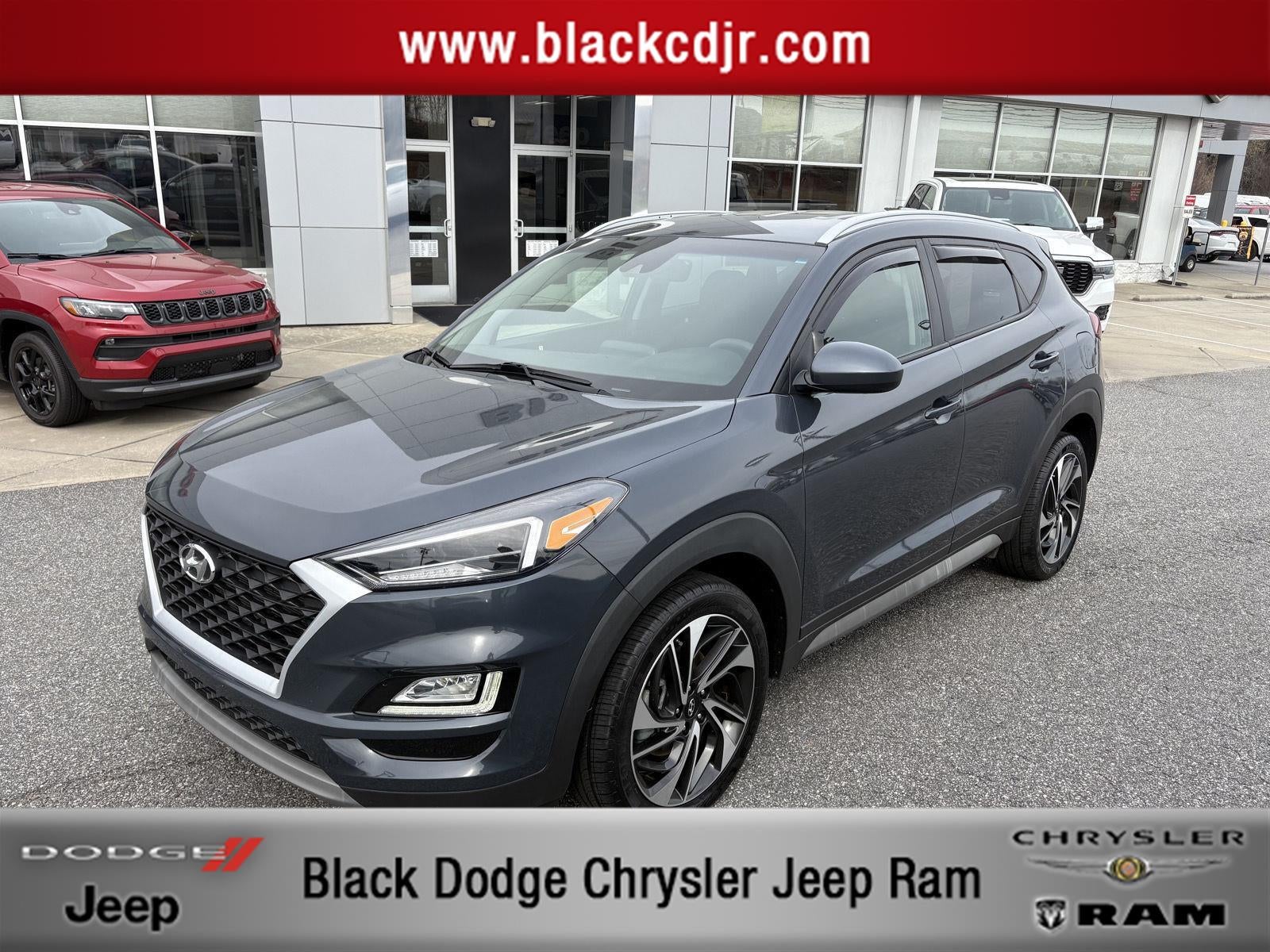 2019 Hyundai Tucson Sport in Dusk Blue — front three-quarter view